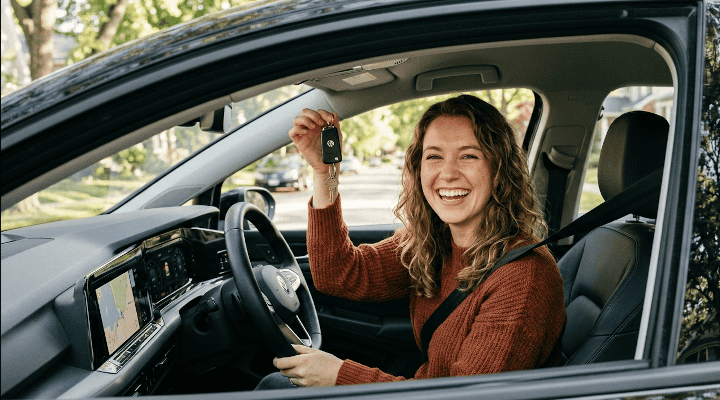 Happy driver with car keys
